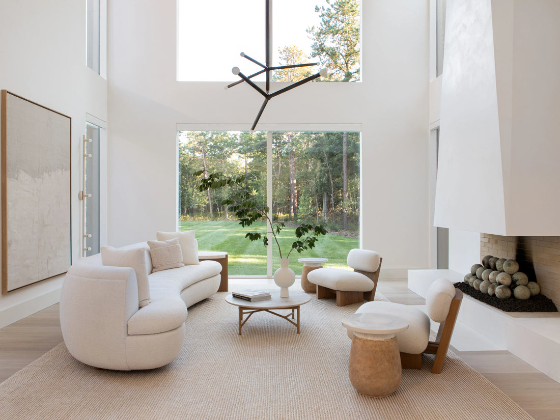 Minimal modern living room with premium décor pieces including vases and sculptures, showing how good aesthetics improve mood and confidence — Aura Works.