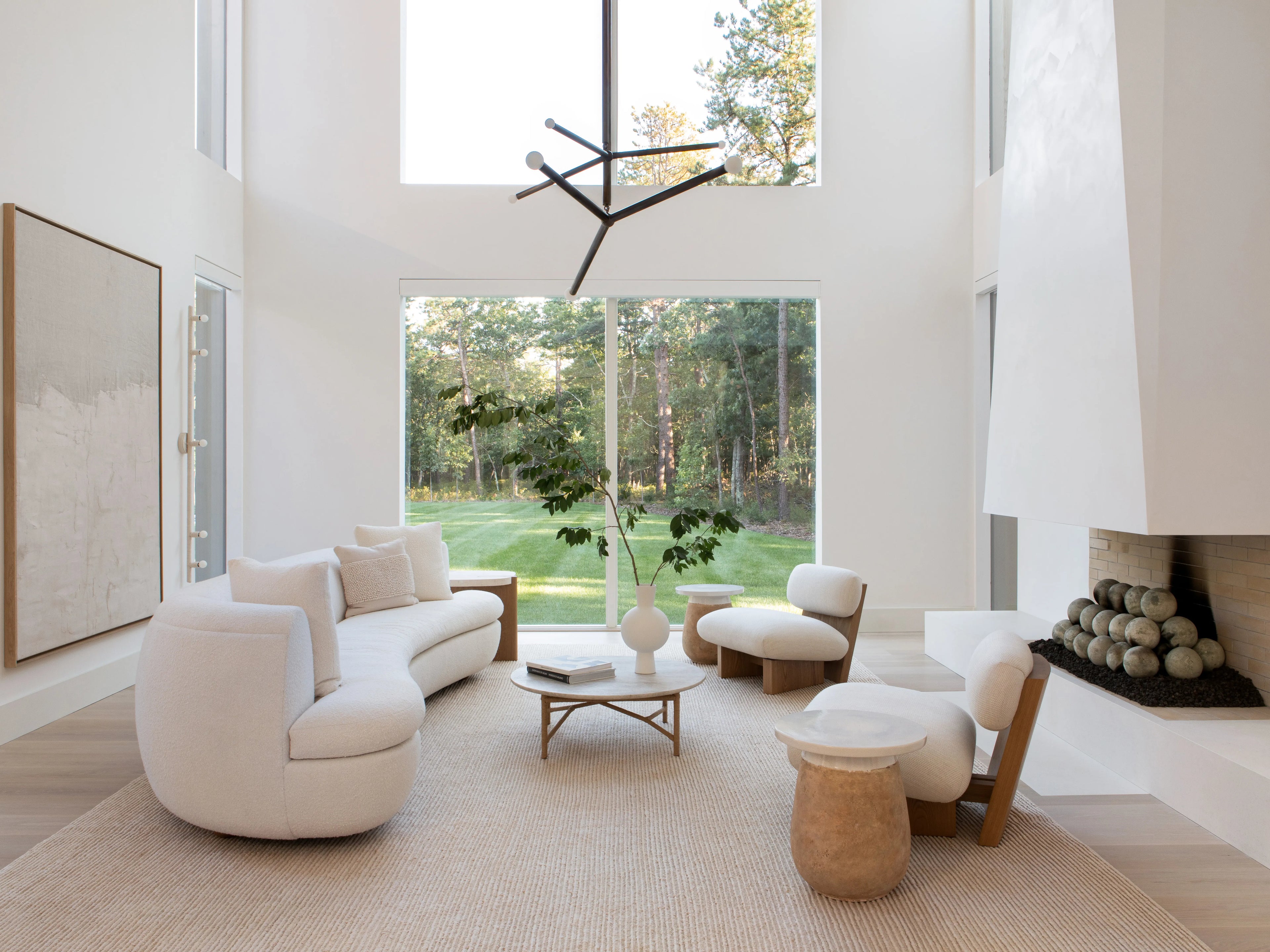 Minimal modern living room with premium décor pieces including vases and sculptures, showing how good aesthetics improve mood and confidence — Aura Works.