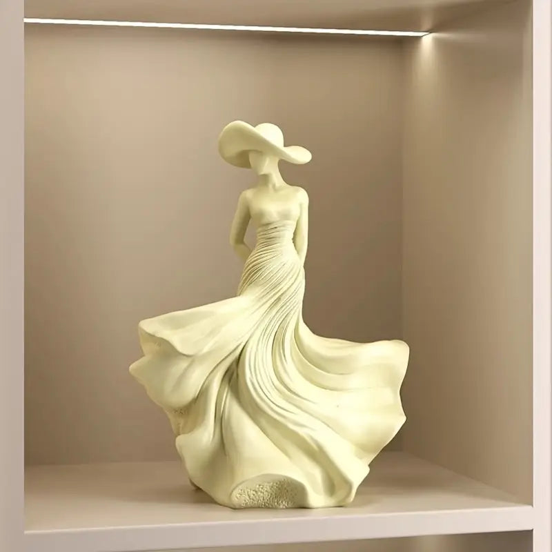 Ivory Serenity Goddess Sculpture in matte cream finish placed on a table – elegant resin decor statue for modern home interiors.