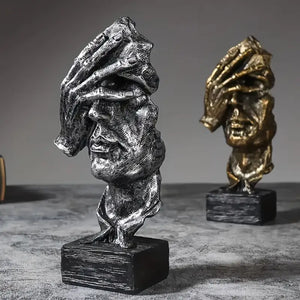 Abstract Broken Face Expressions Sculpture Set of faces on a book with a gray background auraworks decor