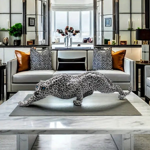 Decorative leopard sculpture on a white surface with a modern interior  background decor auraworks