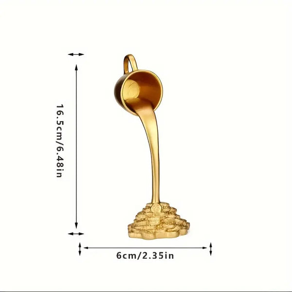Gold-colored ladle with measurements on a white background  decor aura works