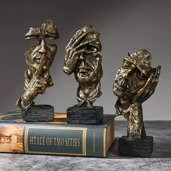 Abstract Broken Face Expressions Sculpture Set of faces on a book with a gray background auraworks decor