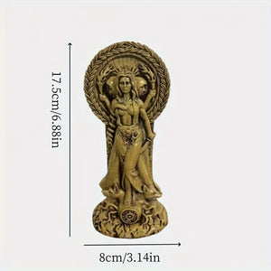 Wooden statue of a deity between two lit candles on a dark surface with  flowers. auraworks Decor