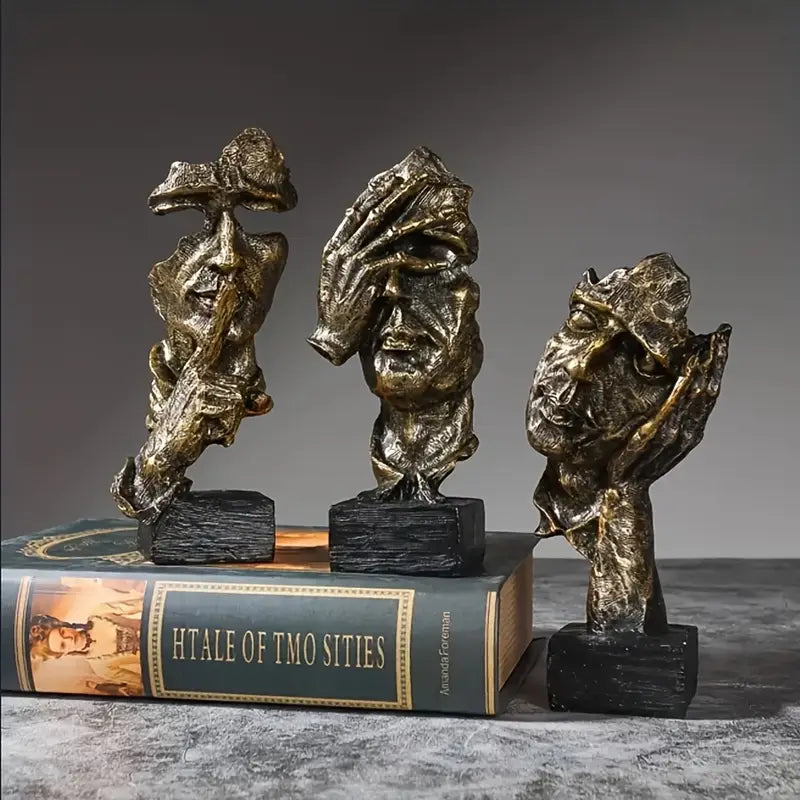 Abstract Broken Face Expressions Sculpture Set of faces on a book with a gray background auraworks decor