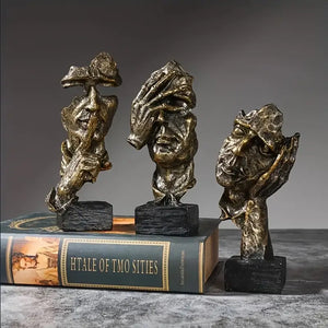 Abstract Broken Face Expressions Sculpture Set of faces on a book with a gray background auraworks decor
