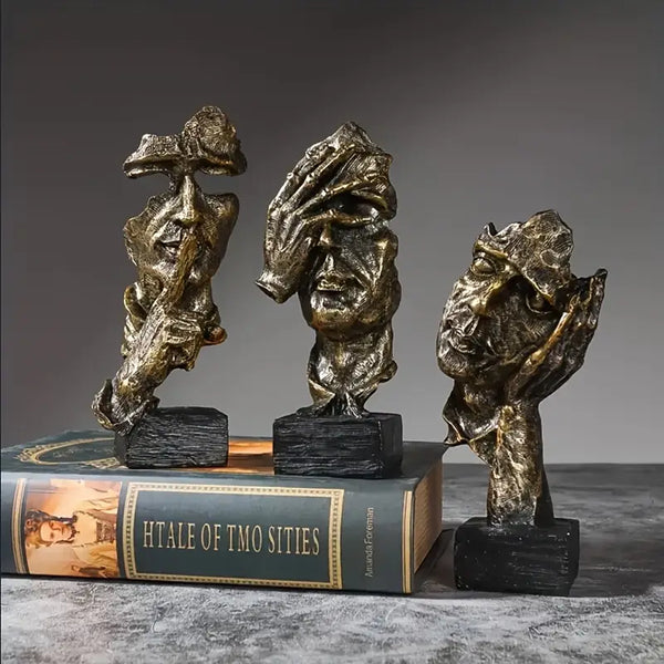 Abstract Broken Face Expressions Sculpture Set of faces on a book with a gray background auraworks decor