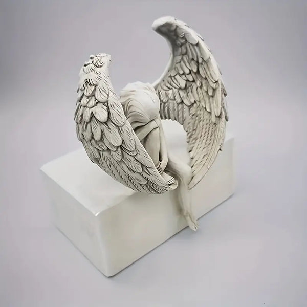 Winged Grace Angel statue in white resin, sitting elegant spiritual home decor. Auraworks