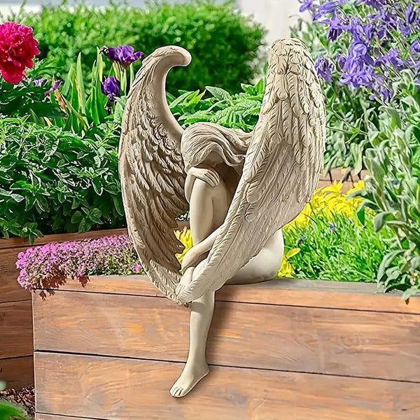 Winged Grace Angel statue in white resin, sitting elegant spiritual home decor. Auraworks