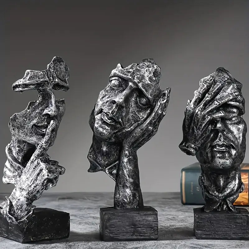 Abstract Broken Face Expressions Sculpture Set of faces on a book with a gray background auraworks decor
