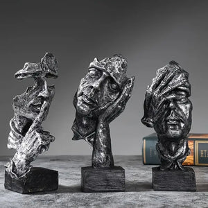Abstract Broken Face Expressions Sculpture Set of faces on a book with a gray background auraworks decor