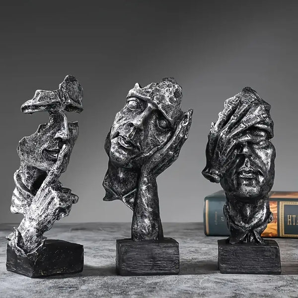 Abstract Broken Face Expressions Sculpture Set of faces on a book with a gray background auraworks decor