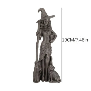 Statue of a witch with a broom and dog, with a measurement label on a white background decor aura works