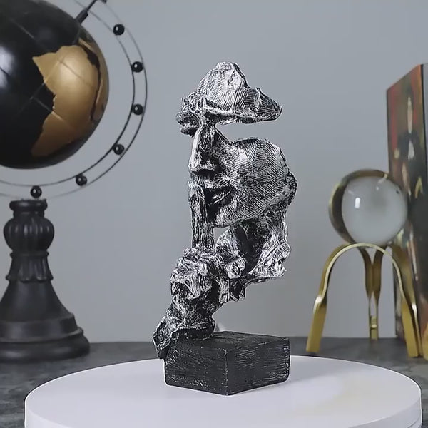 Abstract Broken Face Expressions Sculpture Set of faces on a book with a gray background auraworks decor