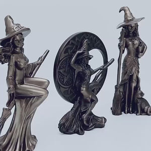 Three metallic witch figurines with brooms on a white background decor auraworks