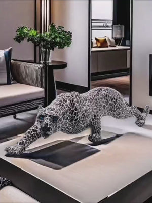 Decorative leopard sculpture on a white surface with a modern interior  background decor auraworks
